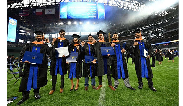 Graduates at commencement ceremonies at Globe Life Field